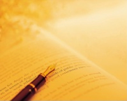 pen on open page of a book photograph